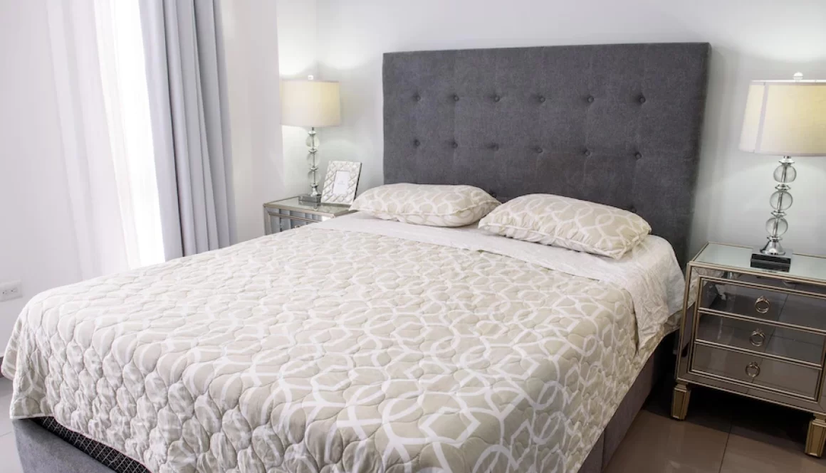 beautiful-view-of-a-modern-bedroom-in-white-colors_181624-59963