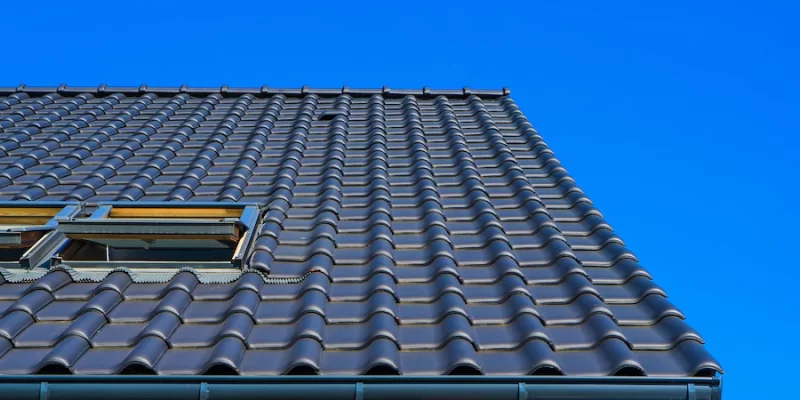 vertical-low-angle-closeup-shot-of-the-black-roof-of-a-building_181624-10654